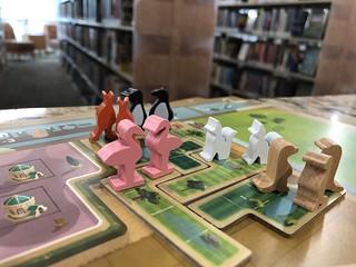 New York Zoo tabletop game board set up with animal game pieces