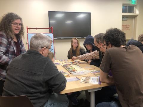 Group playing a tabletop game at the library