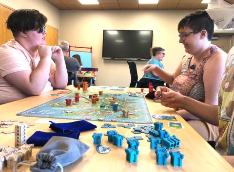 Group playing a tabletop game at the library