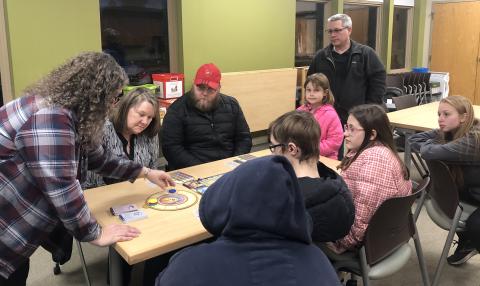 Group playing a tabletop game at the library